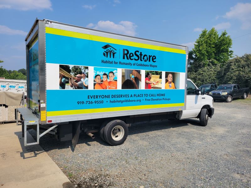 Close-up of a professionally installed vehicle wrap by Mercury Signs showcasing vibrant colors and smooth finish, highlighting durability and quality.