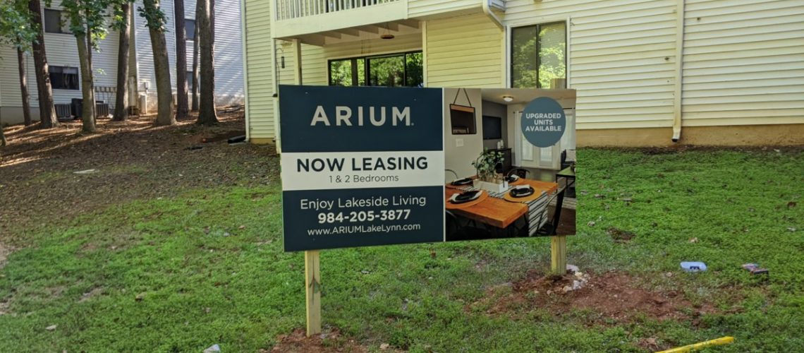 Professional real estate signs featuring bold design elements to attract potential buyers - Arium Real Estate Sign