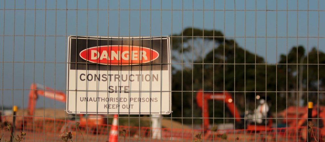 Various construction signs displayed, highlighting safety and regulatory compliance.